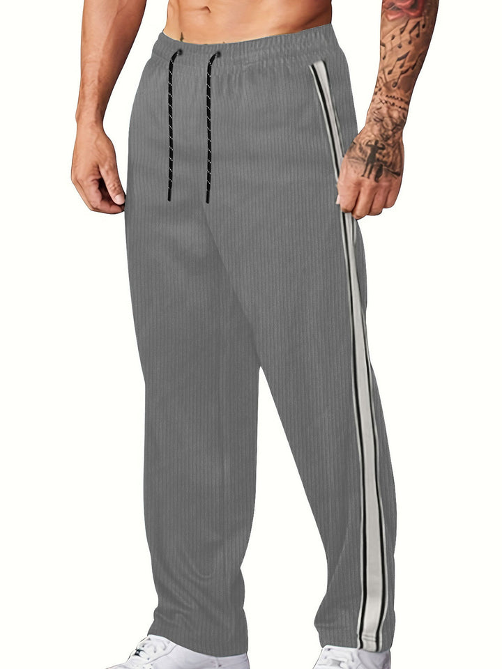 Men's knitted relaxed joggers with wide leg, side piping, and elastic drawstring waistband Mune Fashion