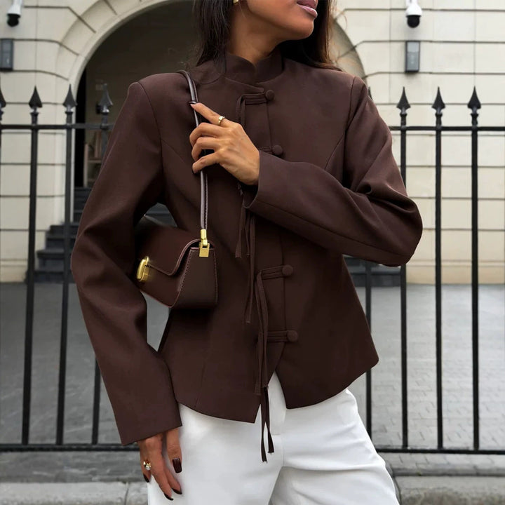 Women's fitted jacket with stand-up collar, Chinese knot fastenings, and slightly cropped cut.