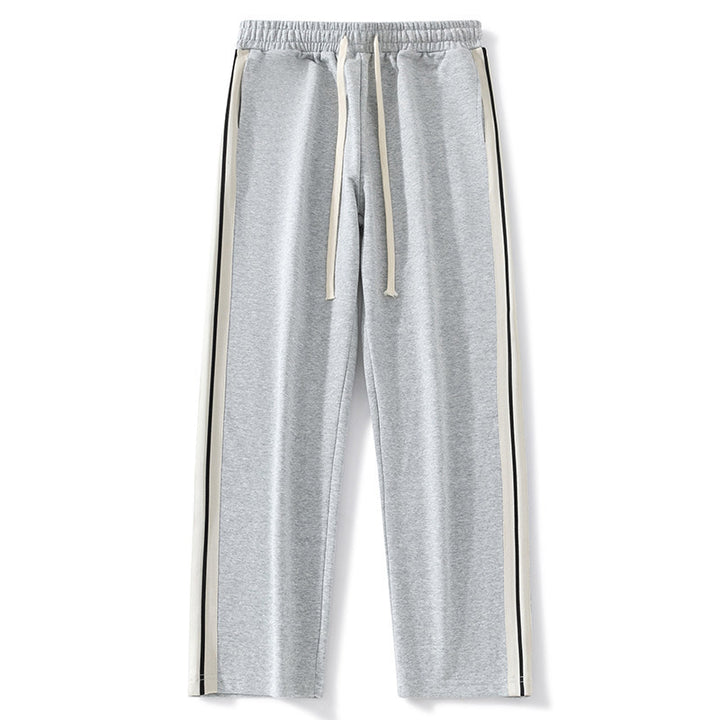 Men's loose-fitting joggers with elastic waistband, drawstring, and contrasting side stripes Mune Fashion