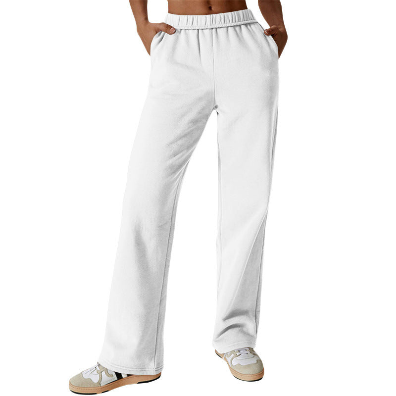Women's high-cut loose jogging pants made of soft sweat fabric with elastic waistband and side pockets Mune Fashion