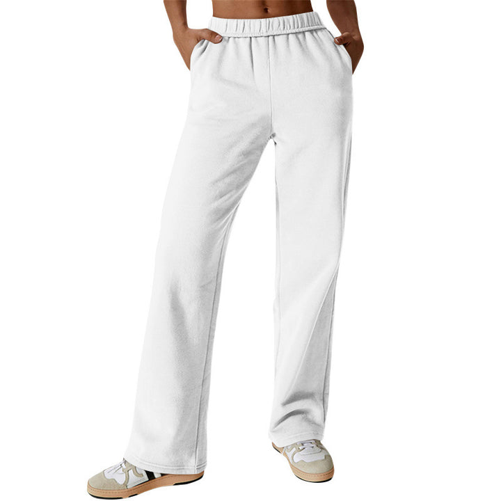 Women's high-cut loose jogging pants made of soft sweat fabric with elastic waistband and side pockets Mune Fashion