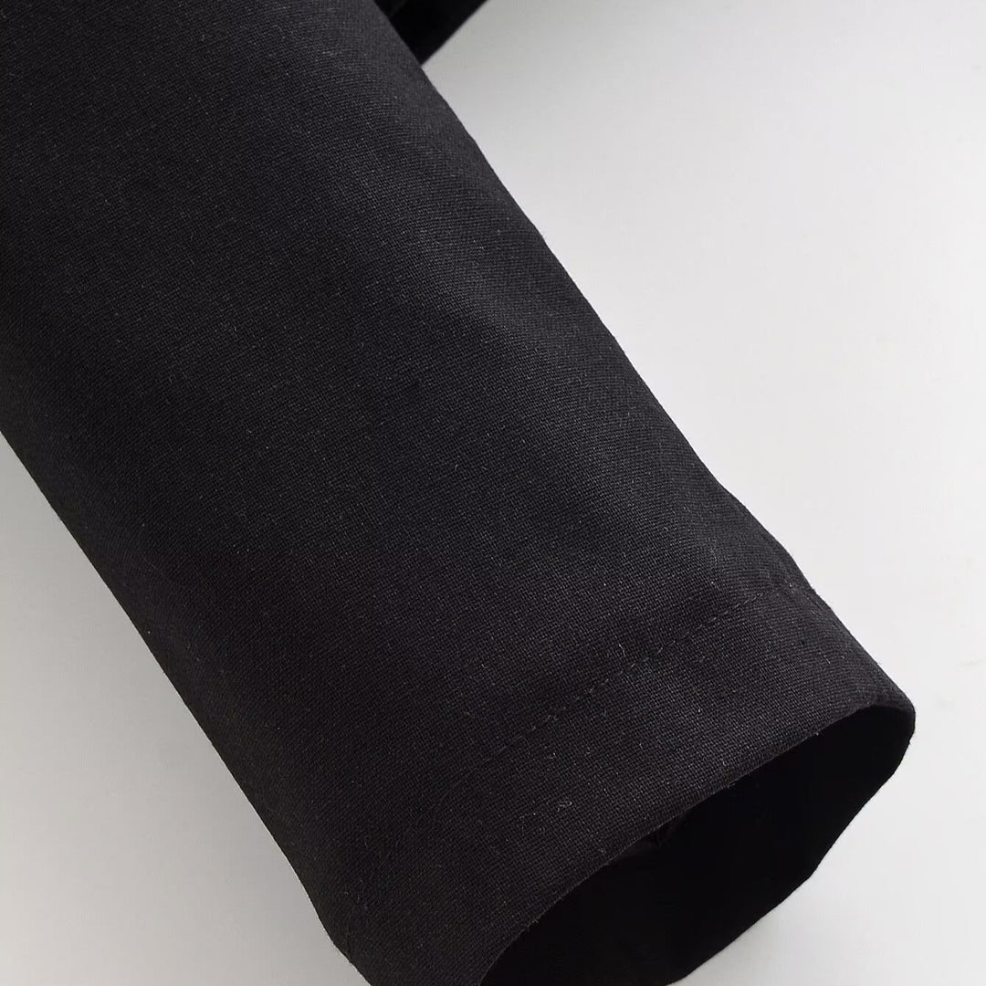 Women's cropped short jacket with stand-up collar, boxy silhouette and minimalist yoke.