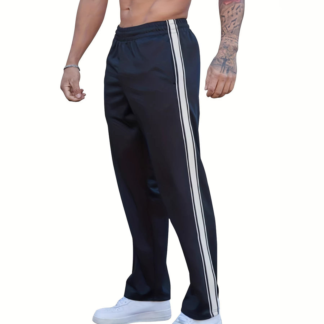 Men's sporty training pants with side tape stripes and elastic waistband Mune Fashion