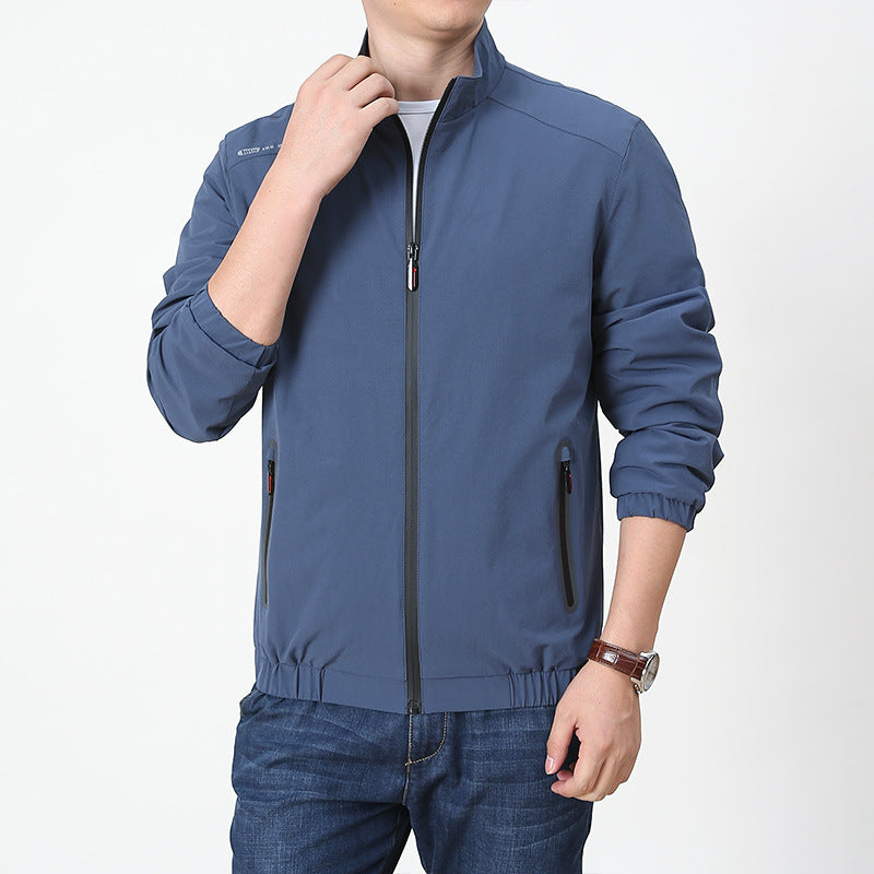 Men's lightweight softshell outdoor jacket with stand-up collar, water-repellent surface and zippered pockets Mune Fashion
