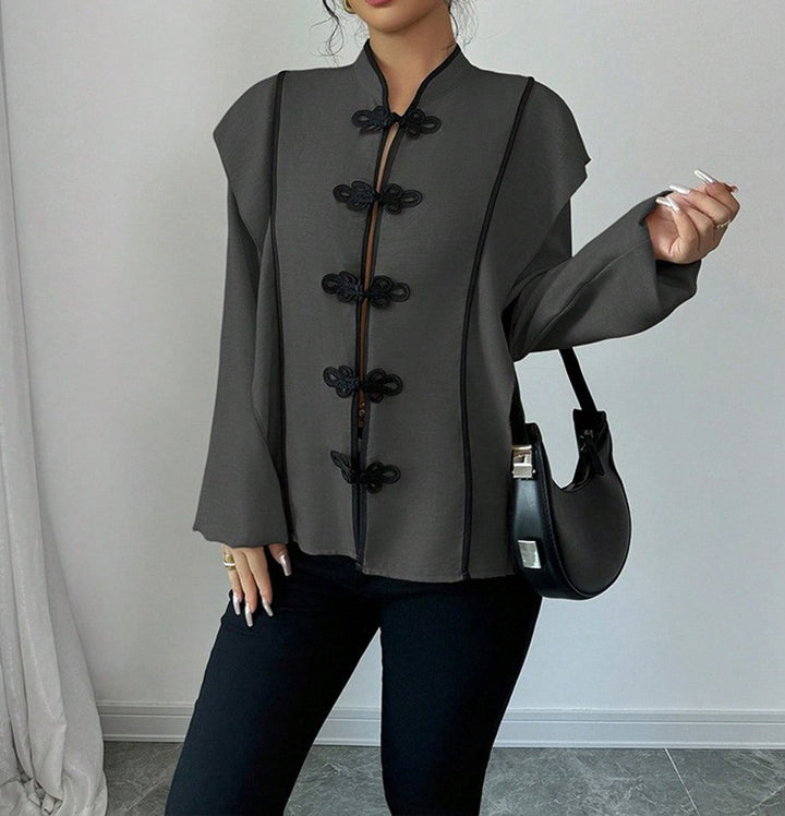 Women's stand-up collar blouse with decorative knot closures and decorative piping Mune Fashion