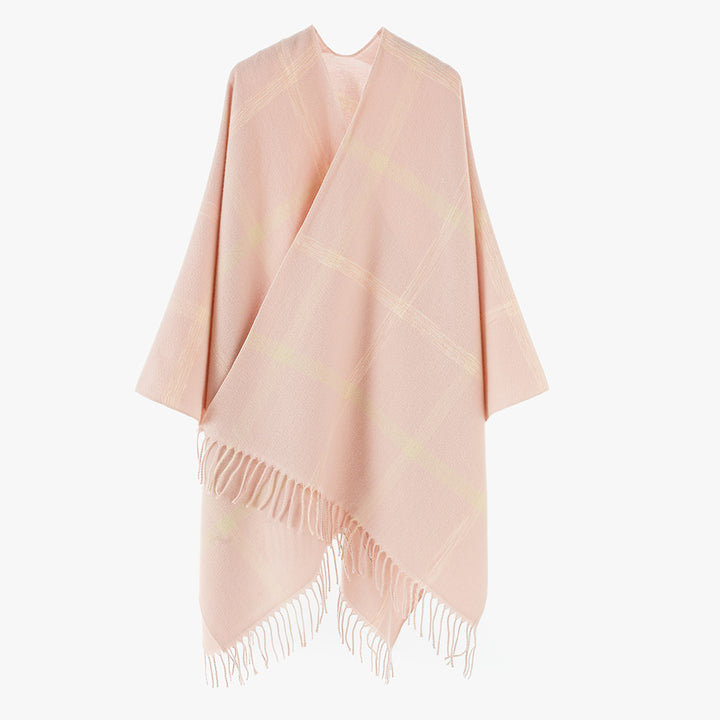 Women's large checkered wool look poncho in cape cut with loose drape and fringes.