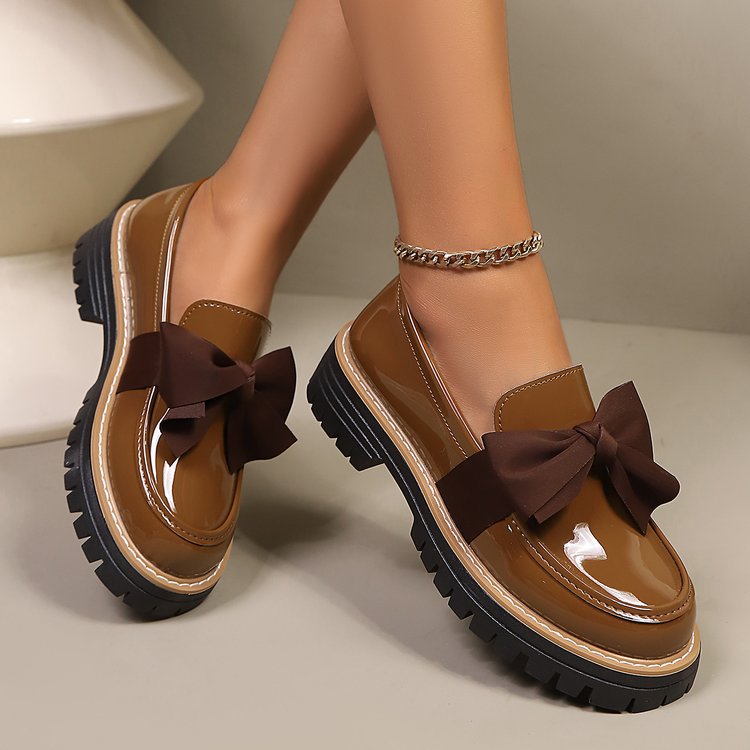 Ladies patent look loafer with massive profile sole and large fabric bow Mune Fashion