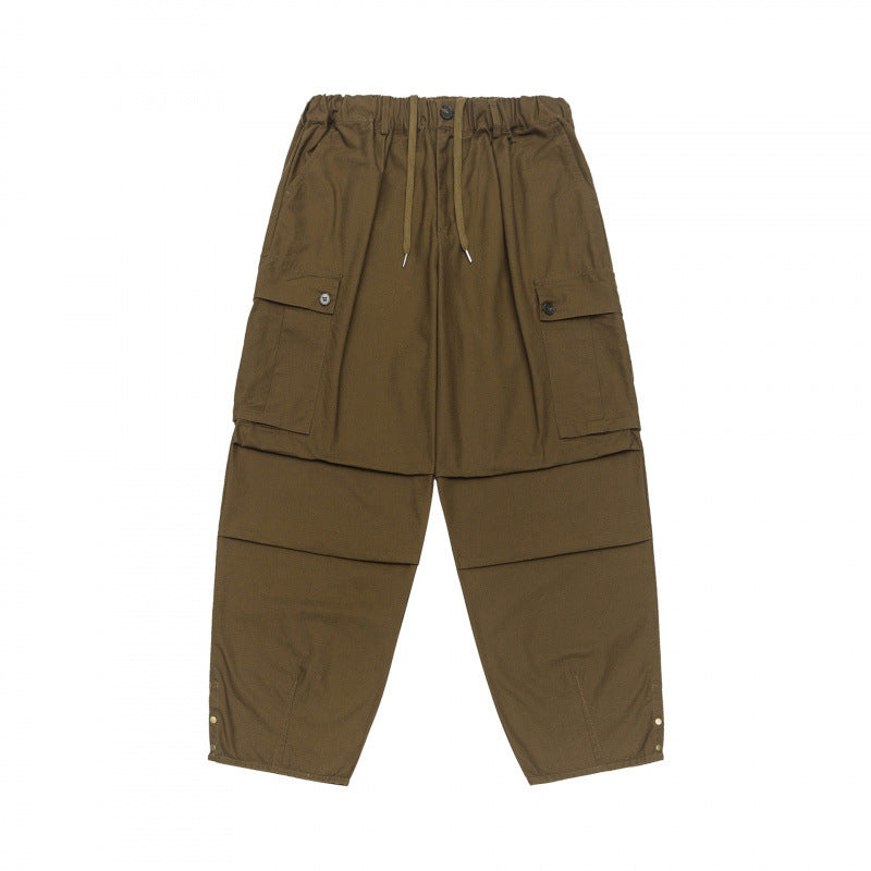 Unisex Oversize Cargo Pants with drawstring waistband, layer detail and snap hem Mune Fashion
