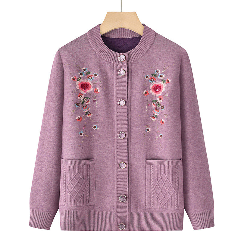 Women's embroidered cardigan with round neckline, decorative button placket, and patch pockets Mune Fashion