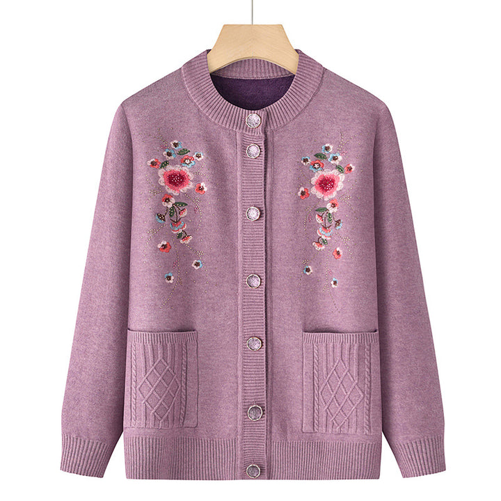 Women's embroidered cardigan with round neckline, decorative button placket, and patch pockets Mune Fashion