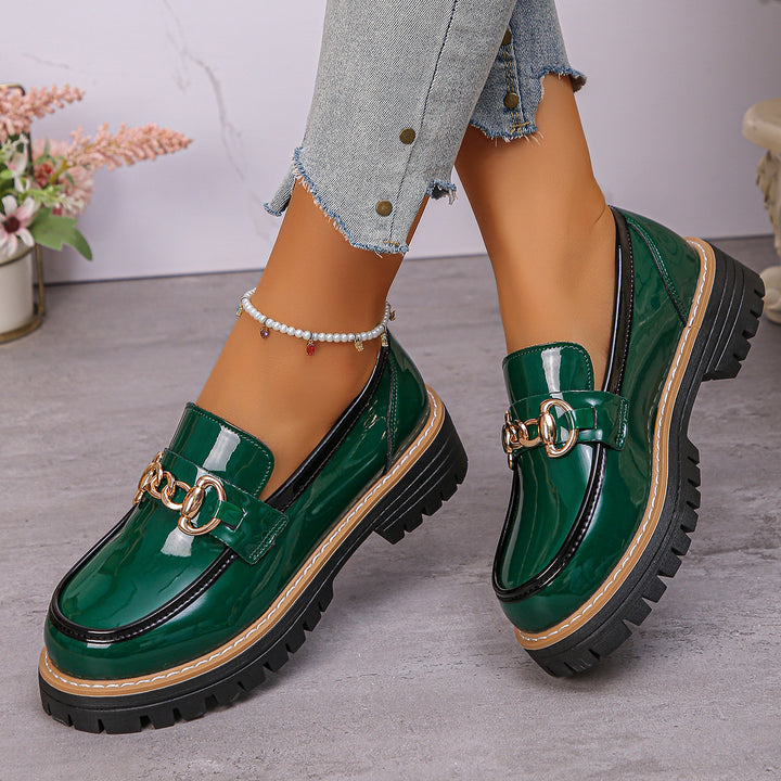 Women's shiny patent loafers with decorative metal buckle and profiled tractor sole Mune Fashion