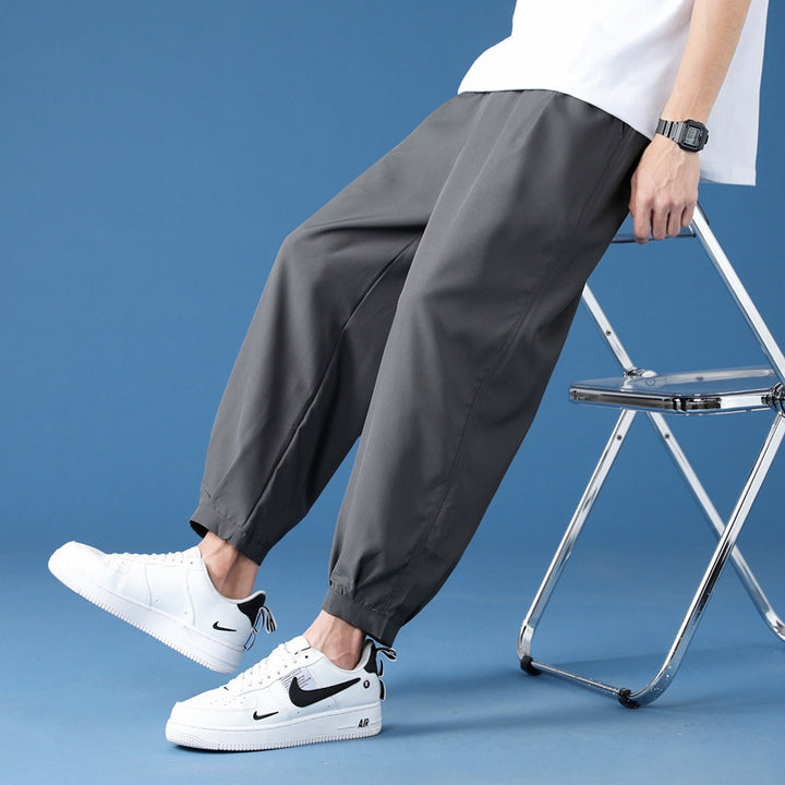 Men's wide technical jogging pants with elastic waistband, gathered leg cuffs, and breathable stretch material Mune Fashion