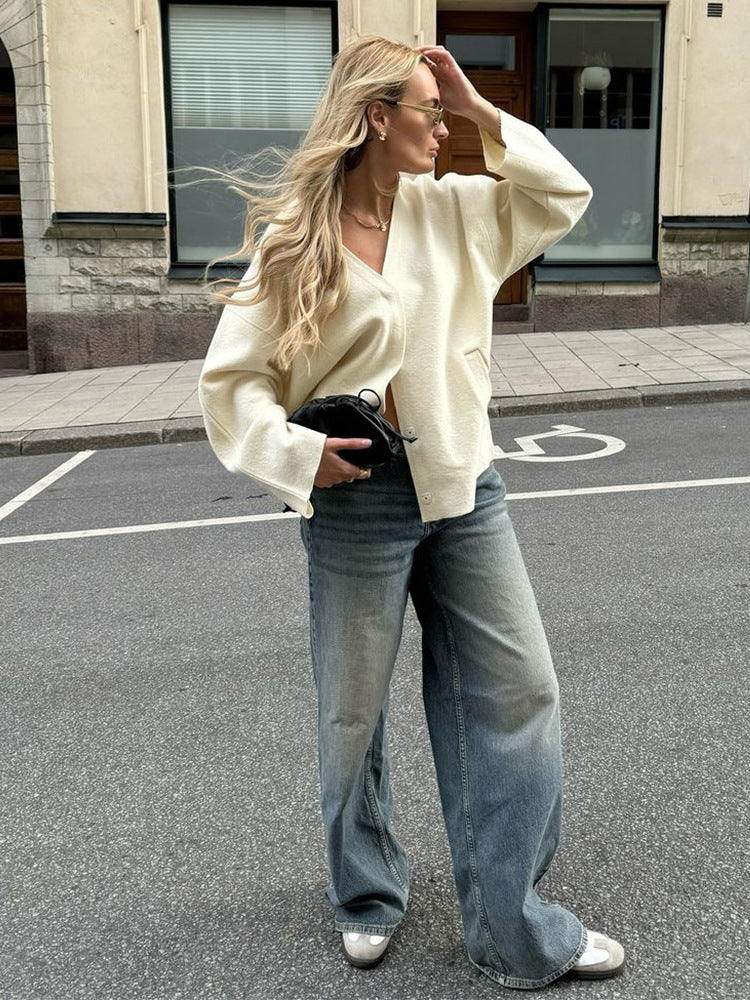 Women's chunky knit cardigan with deep V-neckline, boxy oversized silhouette and patch pockets Mune Fashion