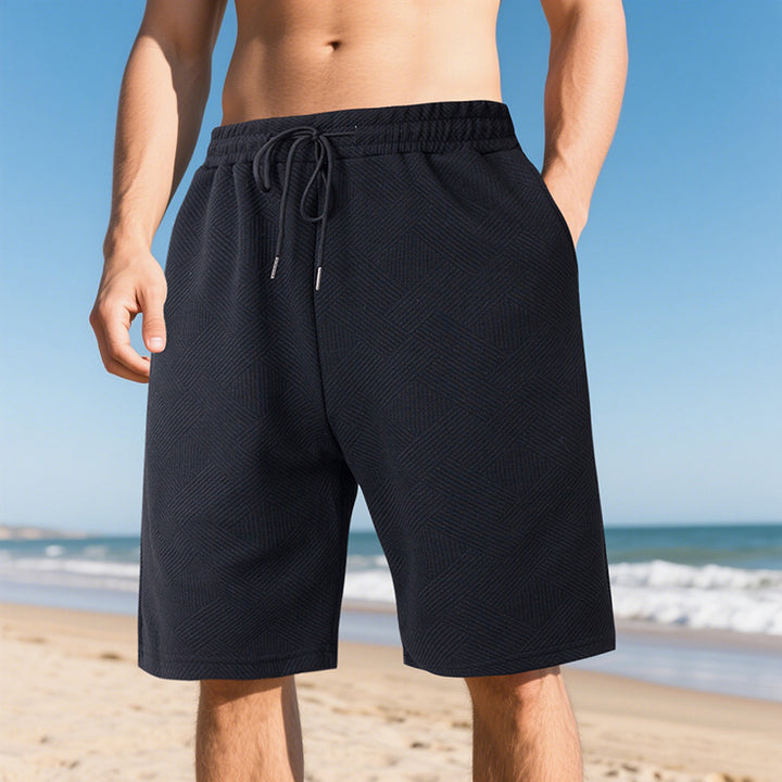 Men's knee-length textured swim shorts with elastic drawstring waistband and side pockets Mune Fashion