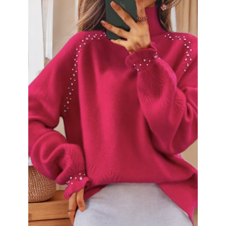 Ladies oversized knit sweater with stand-up collar and pearl details Mune Fashion