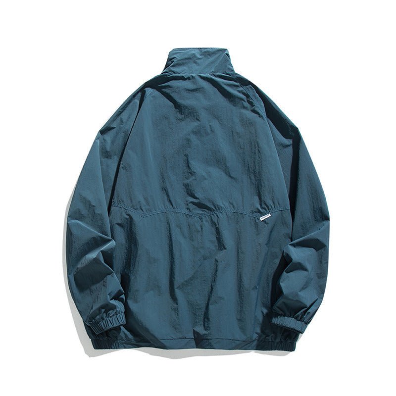 Men's Lightweight Oversized Field Jacket made of technical nylon with stand-up collar, concealed zipper, and flap pockets Mune Fashion