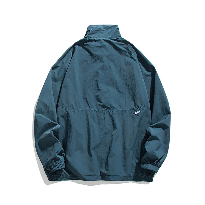 Men's Lightweight Oversized Field Jacket made of technical nylon with stand-up collar, concealed zipper, and flap pockets Mune Fashion