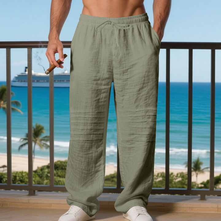 Men's loose linen jogging pants with elastic drawstring waistband, side pockets and padded knee sections Mune Fashion