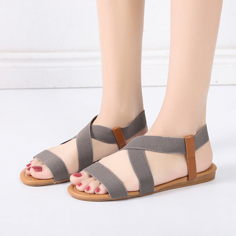 Women's flat elastic strap sandals with crossed stretch bands and padded comfort footbed Mune Fashion