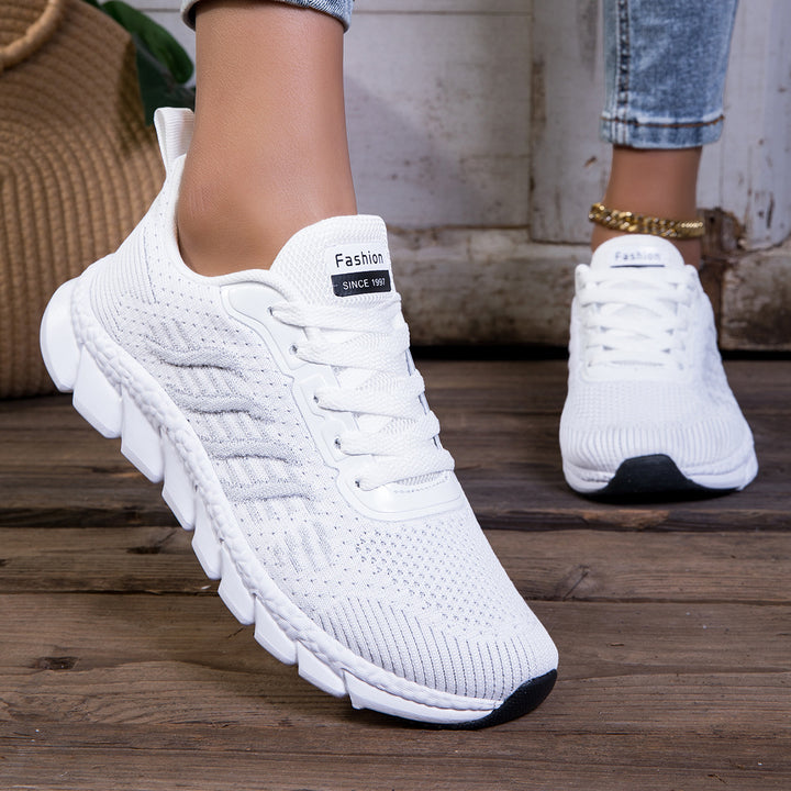 Women's knitted slip-on sneakers with elastic shaft, decorative lacing, and segmented cushioning sole Mune Fashion