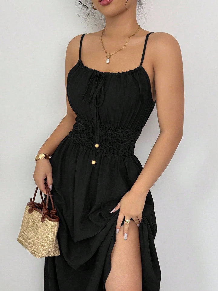 Women’s midi dress with smocked waistband, spaghetti straps, and tie cord Mune Fashion