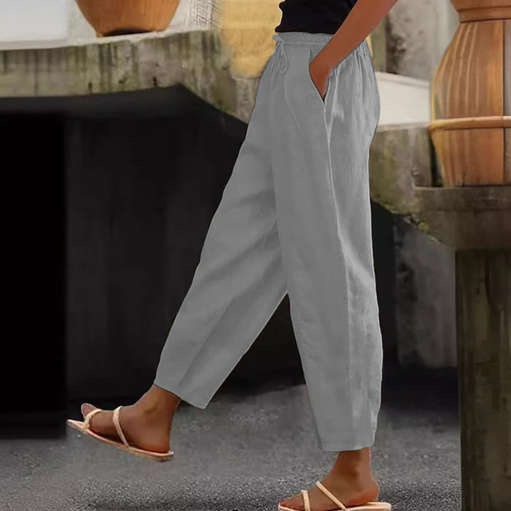 Women's loose-fitting linen blend pants with elastic waistband, drawstring, and angled side pockets Mune Fashion