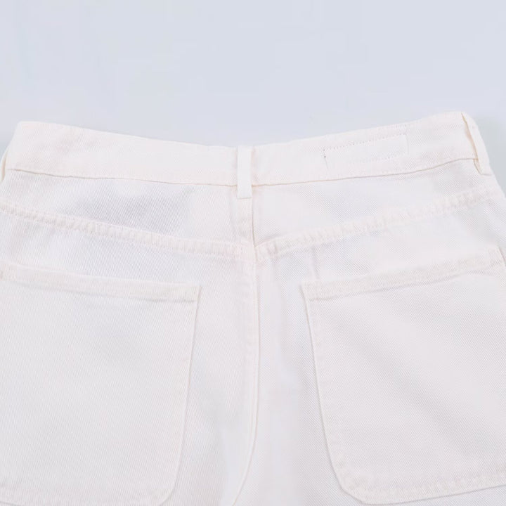 Ladies' wide jeans with a high waist, pressed crease, and patch pockets.