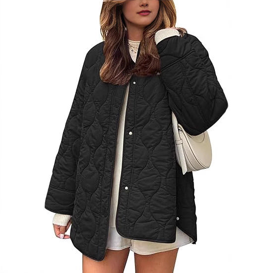 Women's quilted jacket in oversized design with curved quilting and side slit Mune Fashion