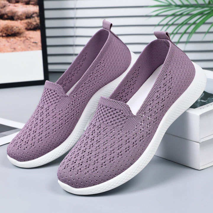 Women’s seamless knit slip-on with perforated air mesh structure, ergonomic memory footbed, and lightweight EVA cushioning Mune Fashion