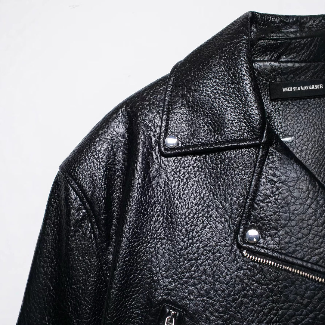 Women's short-cut biker leather jacket with fitted belt, asymmetrical zipper, and textured leather Mune Fashion