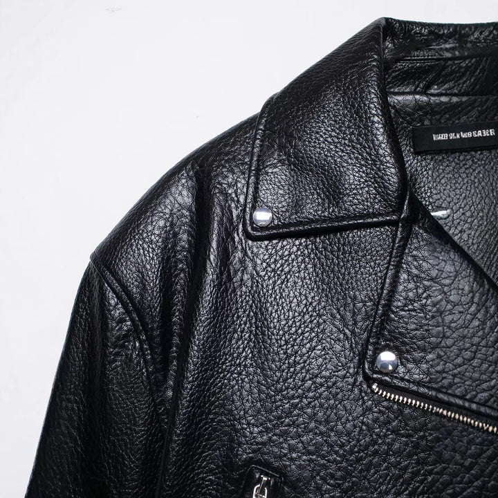Women's short-cut biker leather jacket with fitted belt, asymmetrical zipper, and textured leather Mune Fashion