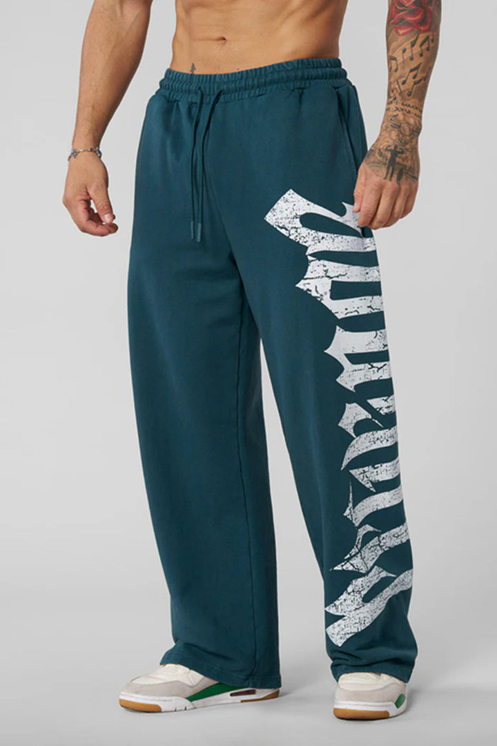 Men's wide sweatpants made of brushed fleece with side vintage print and drawstring waistband Mune Fashion