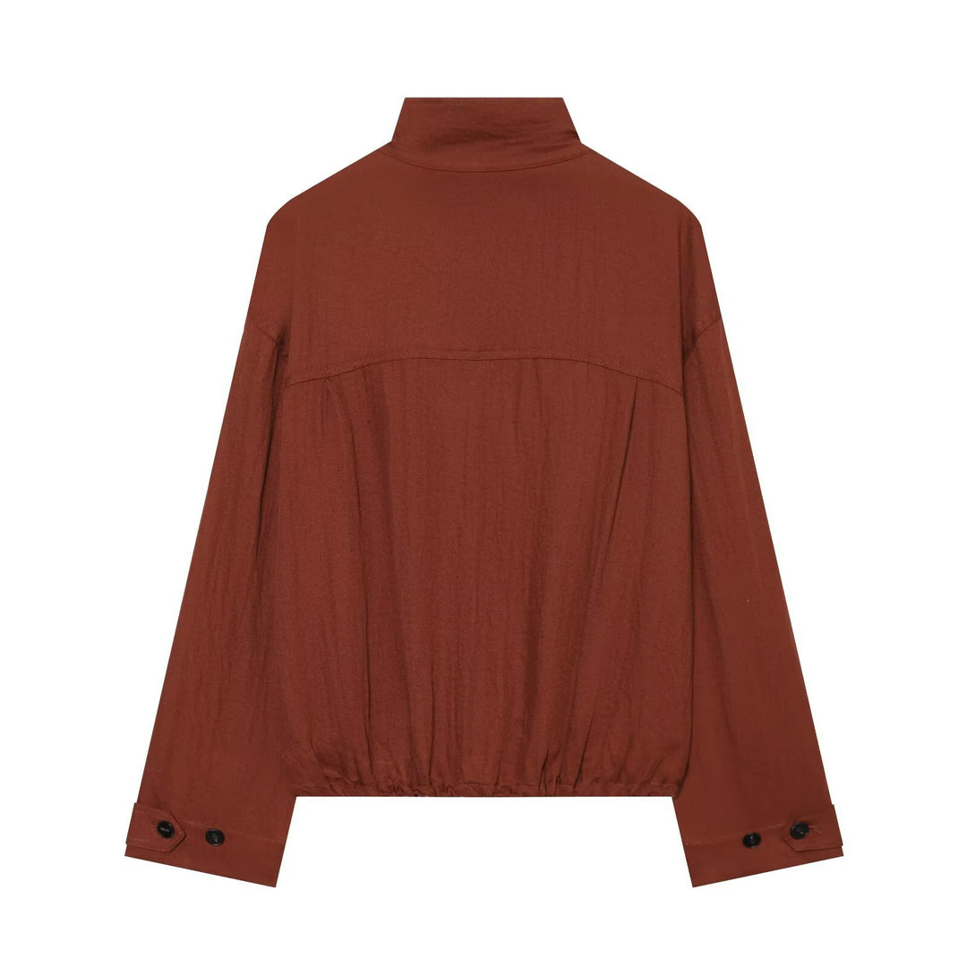 Women's short jacket in utility style with stand-up collar, patch chest pockets, and drawstring hem Mune Fashion