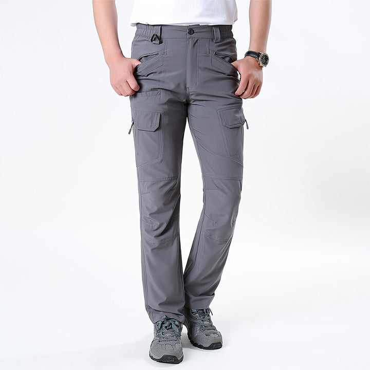 Men's nano technical trekking pants with elastic waistband, pre-shaped knees, and multiple cargo and zip pockets.