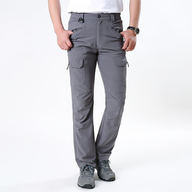 Men's nano technical trekking pants with elastic waistband, pre-shaped knees, and multiple cargo and zip pockets.