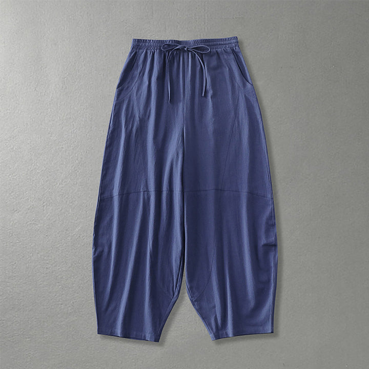 Women's wide harem pants made of lightweight satin with drawstring and side pockets Mune Fashion