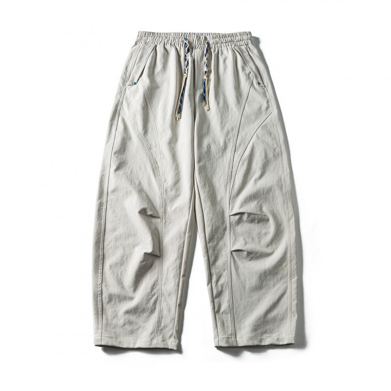 Unisex Wide Cropped Pants with Drawstring, Elastic Waistband and Distinctive Seam Panels Mune Fashion