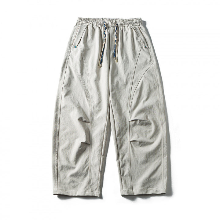 Unisex Wide Cropped Pants with Drawstring, Elastic Waistband and Distinctive Seam Panels Mune Fashion