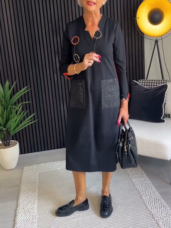 Women's knee-length, loosely falling dress with V-neck contrast pockets made of satin and three-quarter sleeves Mune Fashion