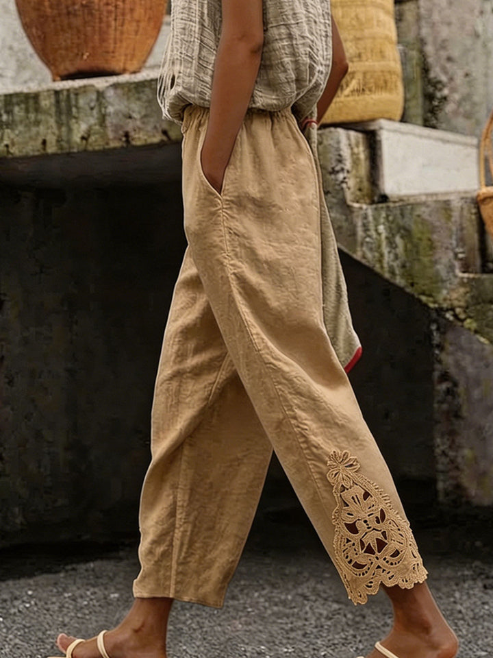 Women's casual pants made of linen blend with elastic drawstring waistband and lace embroidery on the leg