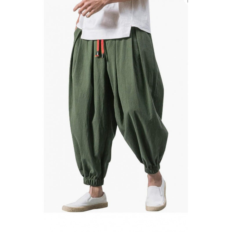 Men's wide-cut harem pants with low crotch, elastic waistband, and decorative drawstring Mune Fashion