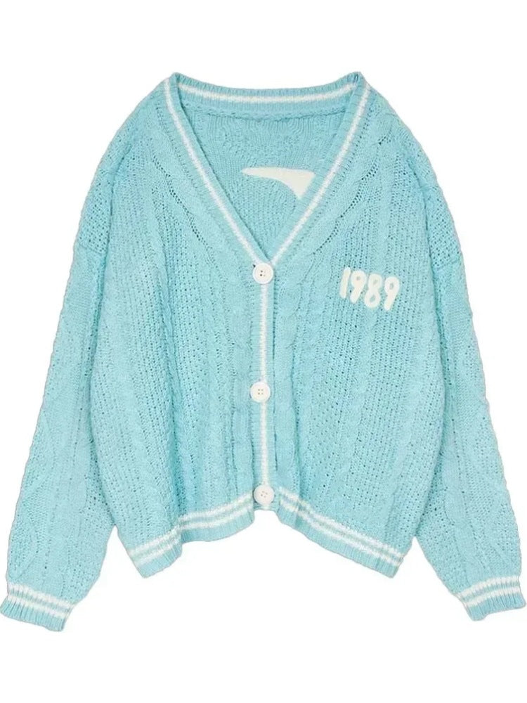 Women’s cropped cardigan with V-neck, contrast piping and oversized sleeves Mune Fashion