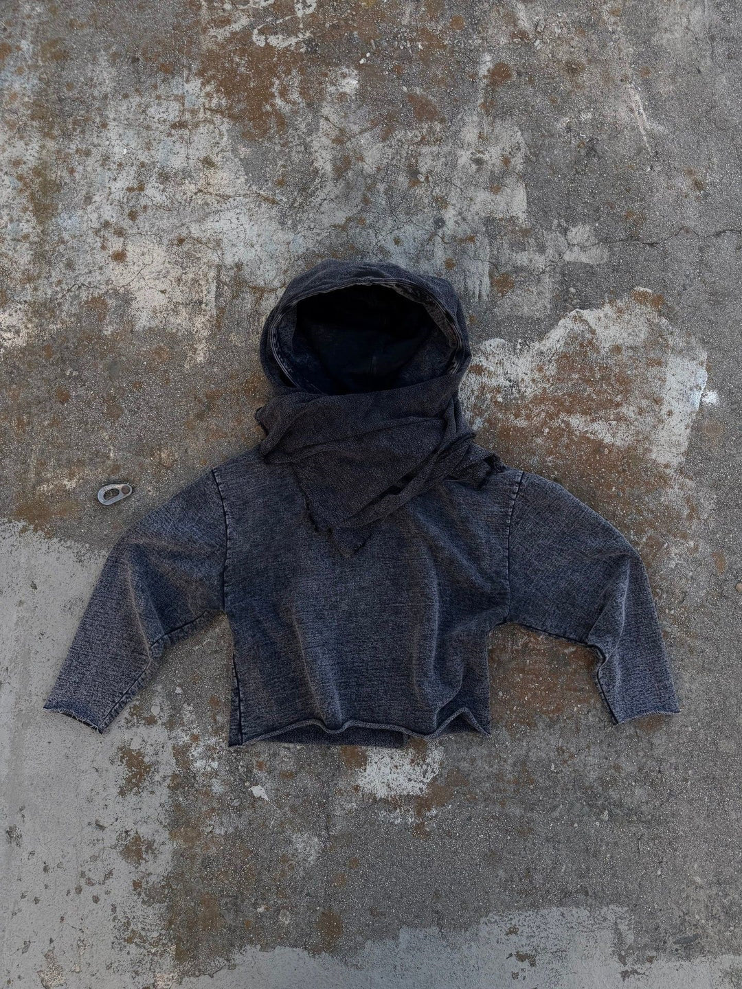 Unisex hooded pullover in usage marks style with attached tube scarf and frayed openings Mune Fashion