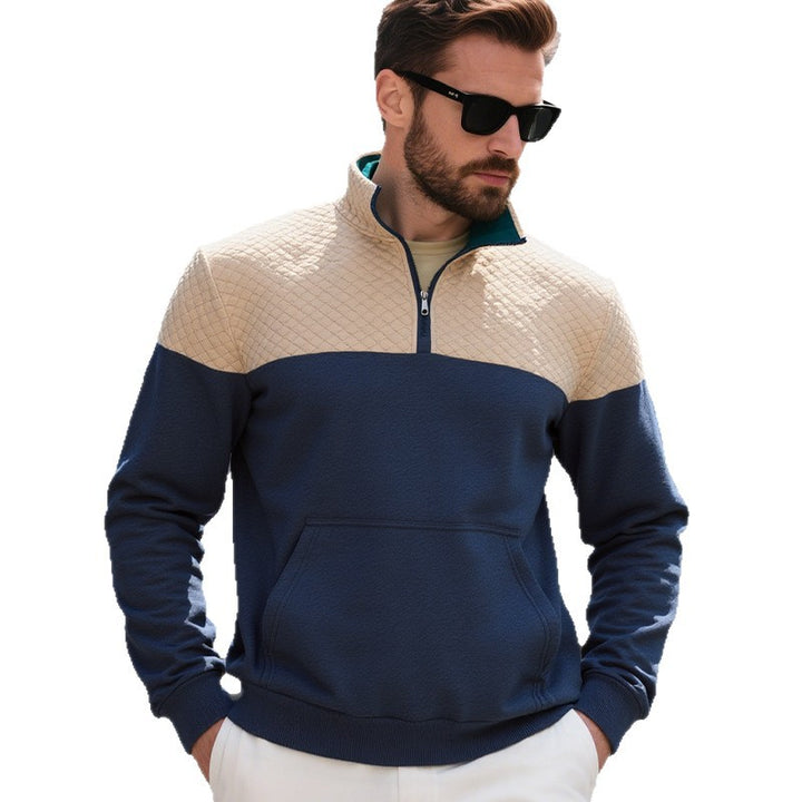 Men's color block half zip sweatshirt with quilted chest area, kangaroo pocket, and elastic cuffs Mune Fashion