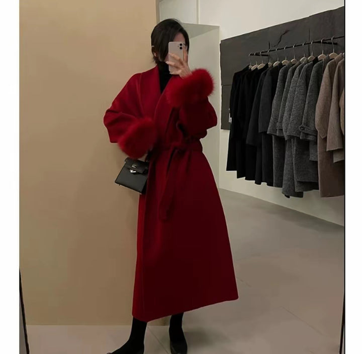 Women's Long Wool Blend Coat with Waist Belt and Voluminous Fur Trim at Sleeve Ends Mune Fashion