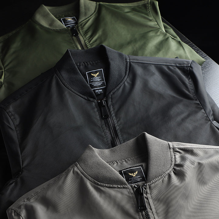 Men's windproof nylon bomber jacket in MA-1 style with arm pocket and ribbed cuffs Mune Fashion