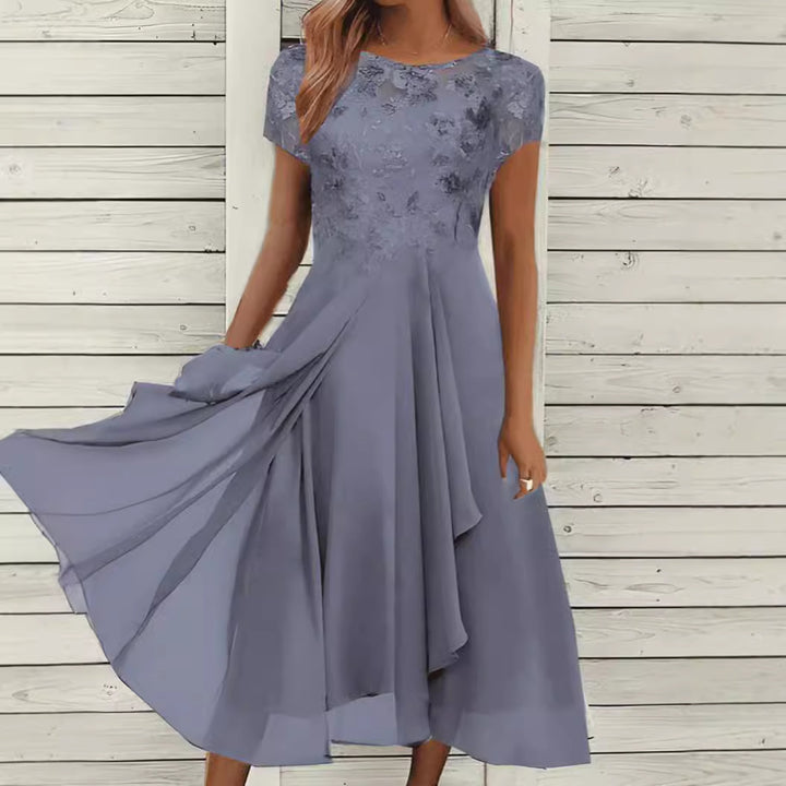 Women's flowing chiffon mid dress with floral embroidered top and asymmetrical tiered skirt Mune Fashion