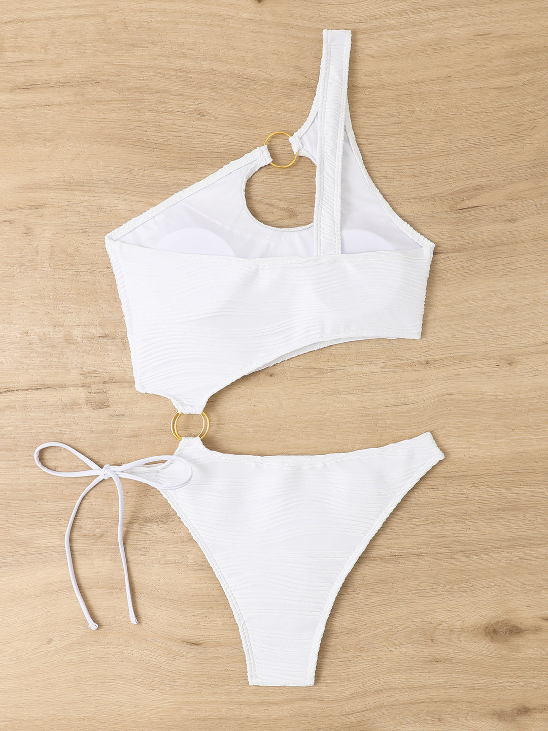 Women's one-piece swimsuit with asymmetrical cut-out and golden accents Mune Fashion