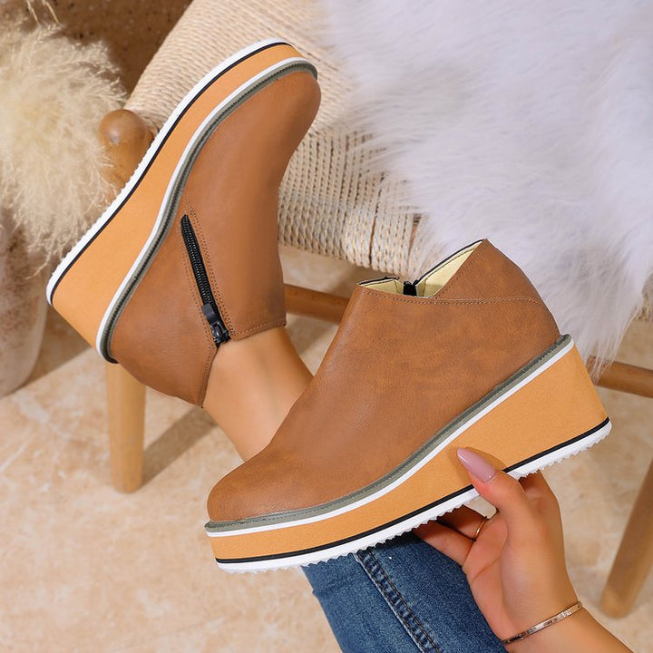Women's Mune Fashion ankle boot with wedge heel, side zipper, and padded comfort insole