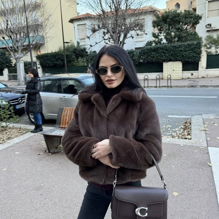Women's short-cut faux fur jacket with notched collar, soft inner lining, and cool cropped silhouette Mune Fashion